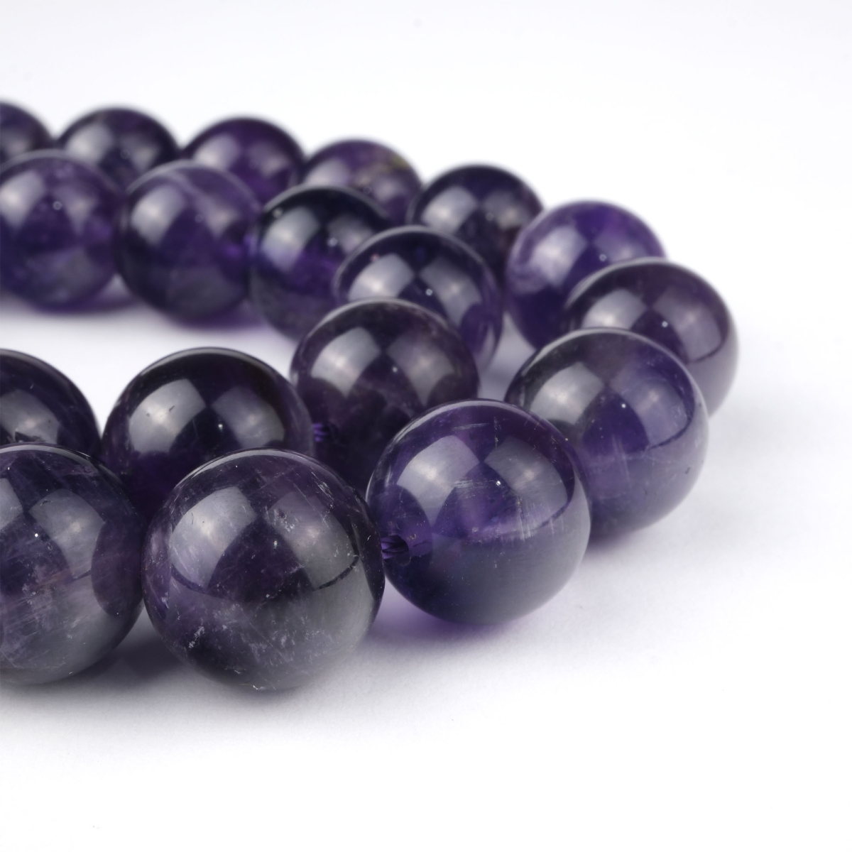Ametist doğal taş dizi 10 mm – morun güçlü tonlarıyla zihin açıklığı, koruma ve ruhsal denge enerjisi sağlayan toptan doğal taş dizi