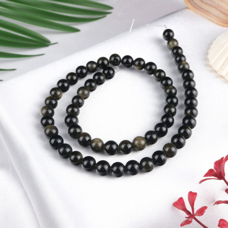 Gold Obsidyen doğal taş dizi 6 mm – siyah zemin üzerinde altın ışıltılarıyla koruma, denge ve enerji gücü sağlayan toptan doğal taş dizi