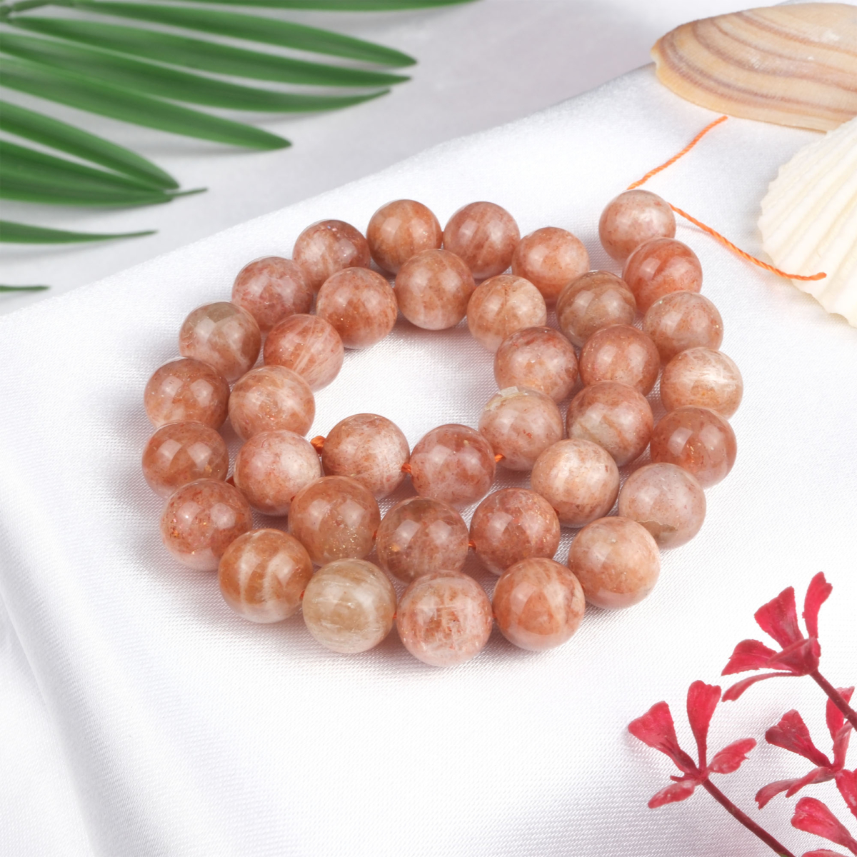 Güneş Taşı doğal taş dizi 10-11 mm – altın ışıltılı turuncu tonlarıyla özgüven, canlılık ve pozitif enerji sağlayan toptan doğal taş dizi