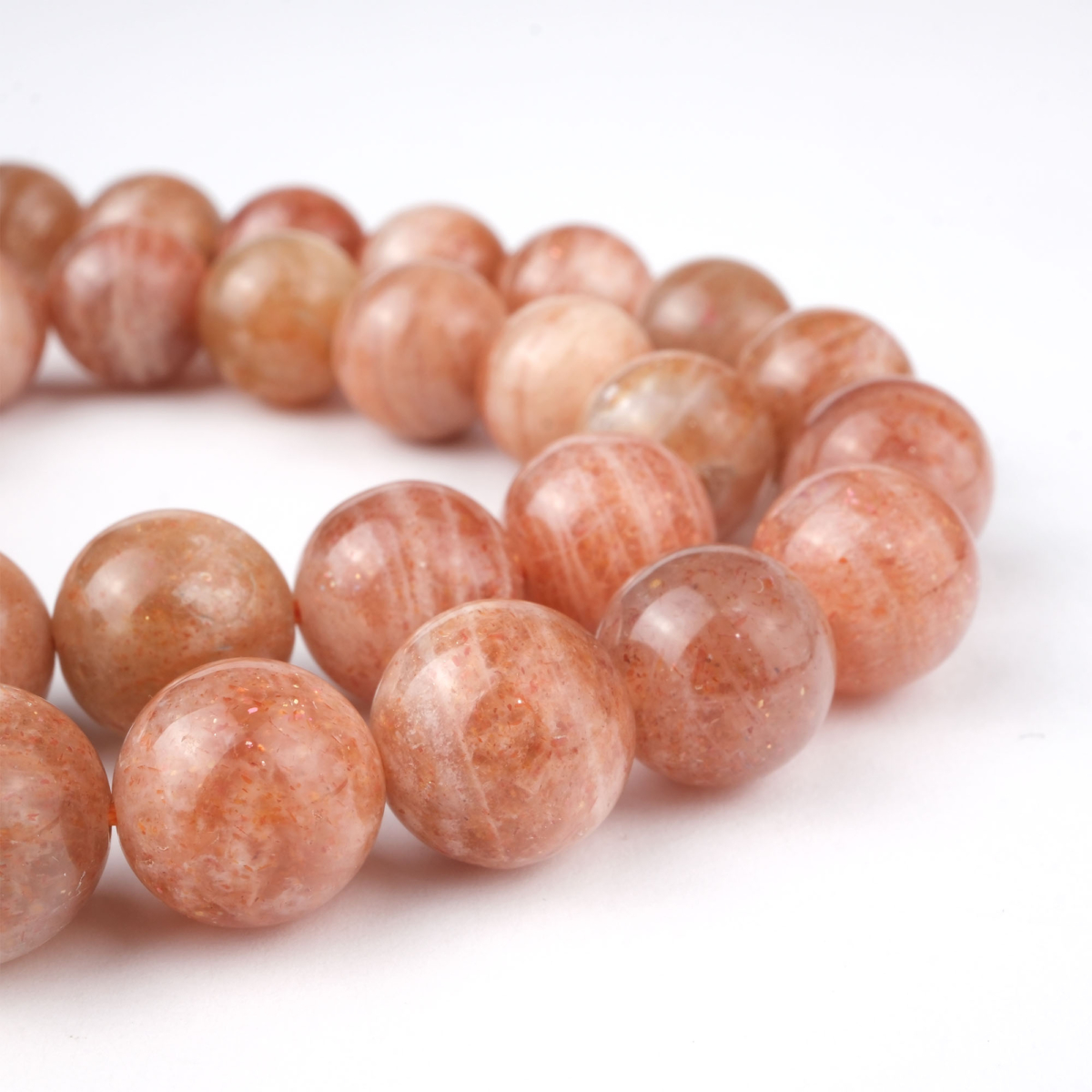 Güneştaşı doğal taş dizi 10 mm – altın ışıltılı turuncu tonlarıyla canlılık, özgüven ve pozitif enerji sağlayan toptan doğal taş dizi