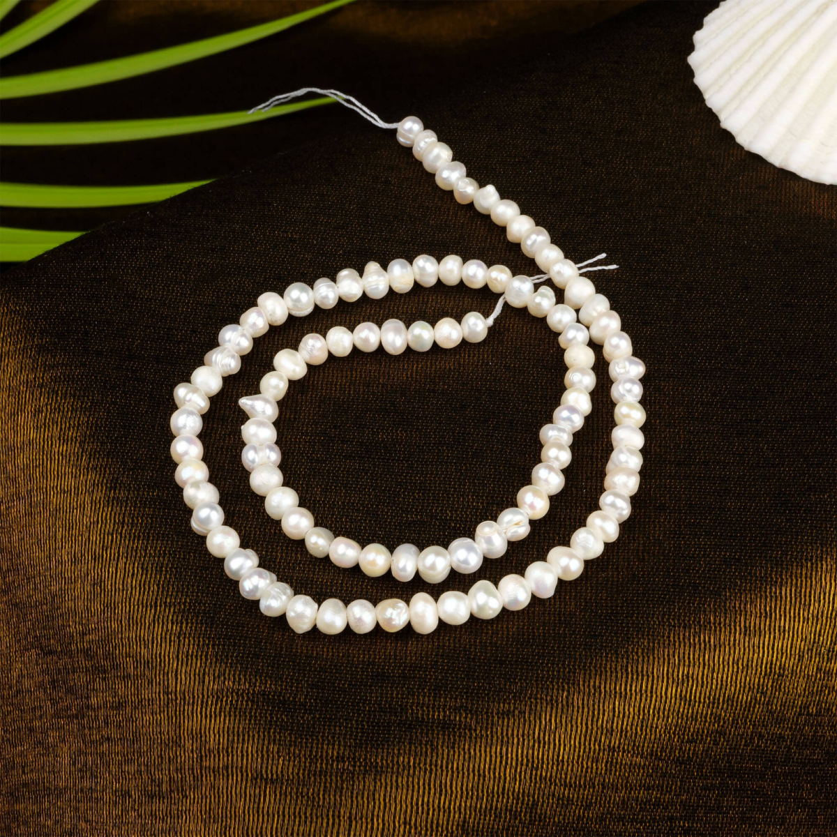 İnci doğal taş dizi 2 mm – zarif beyaz tonlarıyla saflık, sevgi ve ruhsal denge enerjisi sunan toptan doğal taş dizi