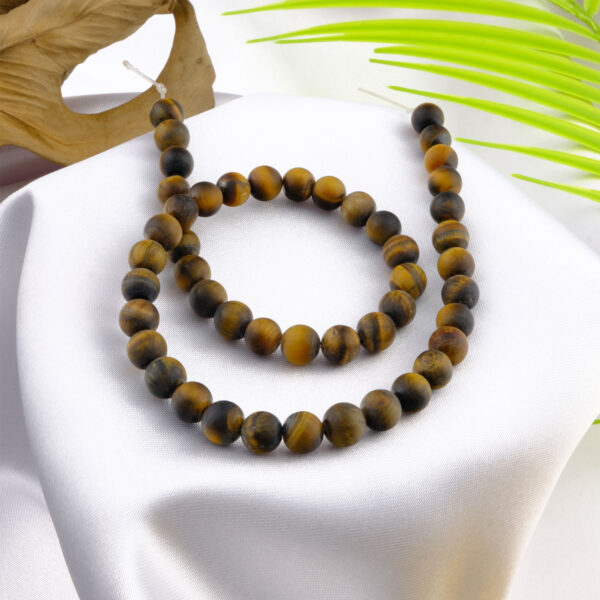 Kaplangözü doğal taş dizi – toptan doğal taş dizi, altın ve kahverengi tonlarıyla güç, cesaret ve koruma enerjisi sunan taş.