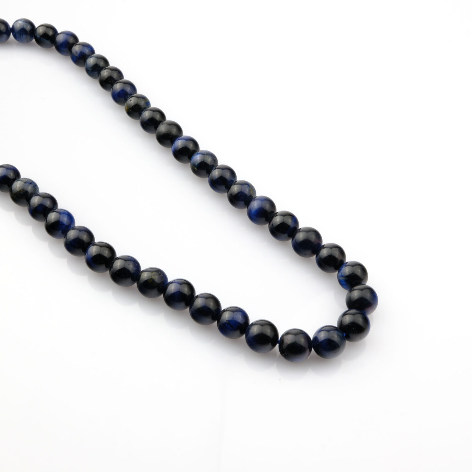 Lacivert Siyah Kaplangözü doğal taş dizi – toptan doğal taş dizi, derin mavi ve siyah tonlarıyla koruma, denge ve odak enerjisi sağlar.