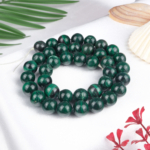 Malahit doğal taş dizi 10 mm – yeşilin farklı tonlarıyla dönüşüm, koruma ve enerji dengeleme sağlayan toptan doğal taş dizi