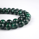 Malahit doğal taş dizi 8 mm – yeşilin canlı tonlarıyla koruma, dönüşüm ve kalp çakrası enerjisini destekleyen toptan doğal taş dizi