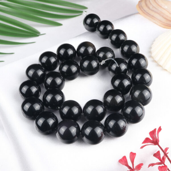 Obsidyen doğal taş dizi 14 mm – volkanik kökenli yapısıyla güçlü koruma, farkındalık ve enerji arınması sağlayan toptan doğal taş dizi