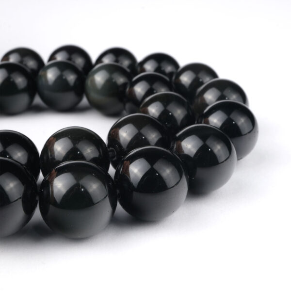 Rainbow Obsidyen doğal taş dizi 12 mm – siyah zemin üzerinde renkli yansımalarıyla koruma, şifa ve farkındalık sağlayan toptan doğal taş dizi