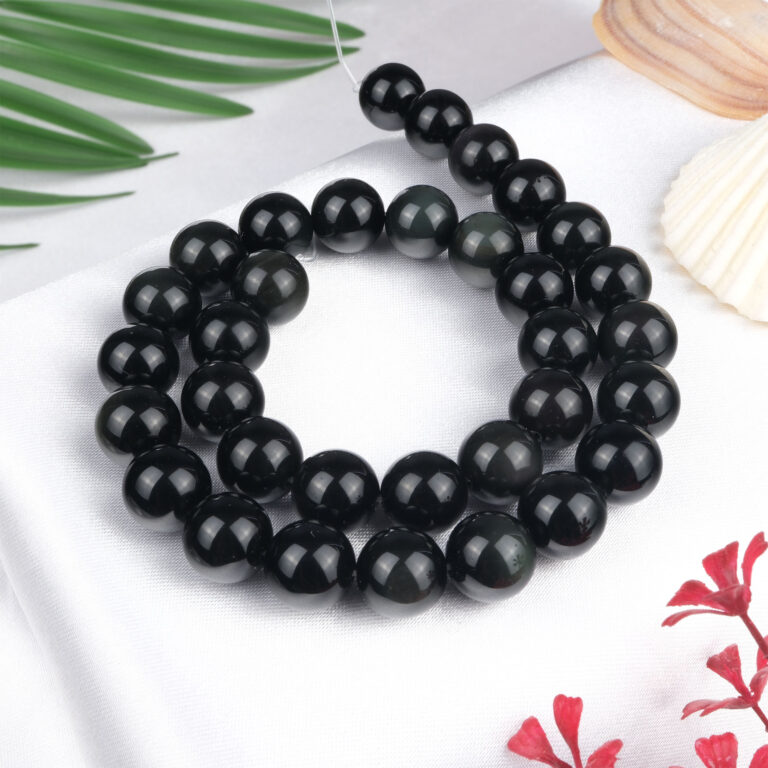 Rainbow Obsidyen doğal taş dizi 12 mm – siyah zemin üzerinde renkli yansımalarıyla koruma, şifa ve farkındalık sağlayan toptan doğal taş dizi