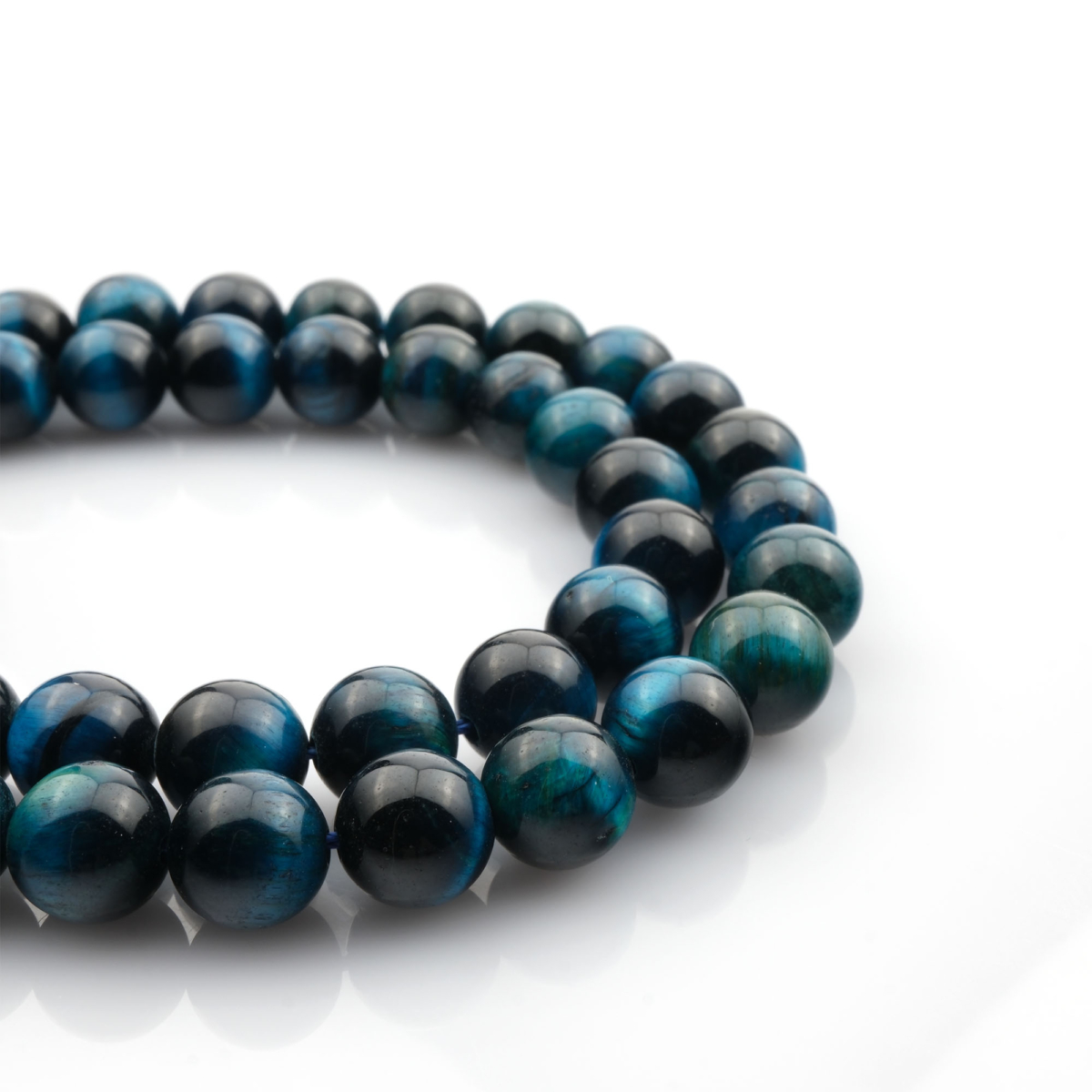 Renkli Kaplangözü doğal taş dizi – toptan doğal taş dizi, altın, mavi ve kırmızı tonlarıyla denge, güç ve koruma enerjisi sağlayan taş.