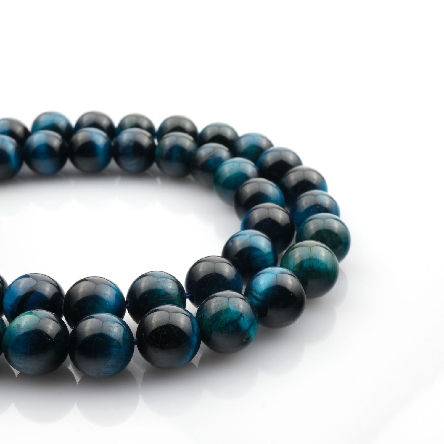 Renkli Kaplangözü doğal taş dizi – toptan doğal taş dizi, altın, mavi ve kırmızı tonlarıyla denge, güç ve koruma enerjisi sağlayan taş.