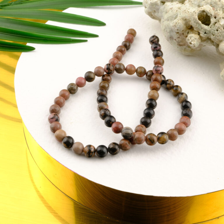 Rodonit doğal taş dizi – toptan doğal taş dizi, pembe ve siyah damar desenleriyle sevgi, şefkat ve denge enerjisi sunan taş.