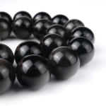 Silver Obsidyen doğal taş dizi 14 mm – siyah zemin üzerinde gümüşi parlak yansımalarıyla koruma, farkındalık ve enerji temizliği sağlayan toptan doğal taş dizi