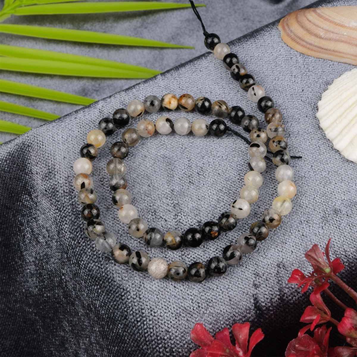 Siyah Rutilli Kuvars doğal taş dizi 6 mm – içindeki siyah iğne damarlarıyla koruma, enerji dengeleme ve odaklanma sağlayan toptan doğal taş dizi