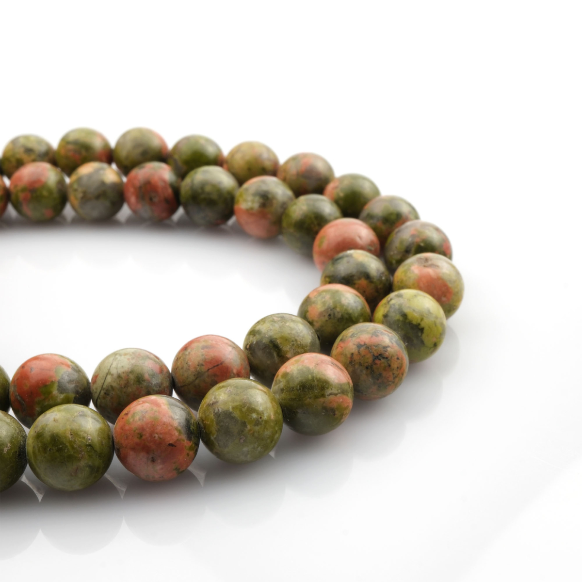 Unakit doğal taş dizi – toptan doğal taş dizi, yeşil ve pembe tonlarıyla denge, şifa ve uyum enerjisi sunan taş.