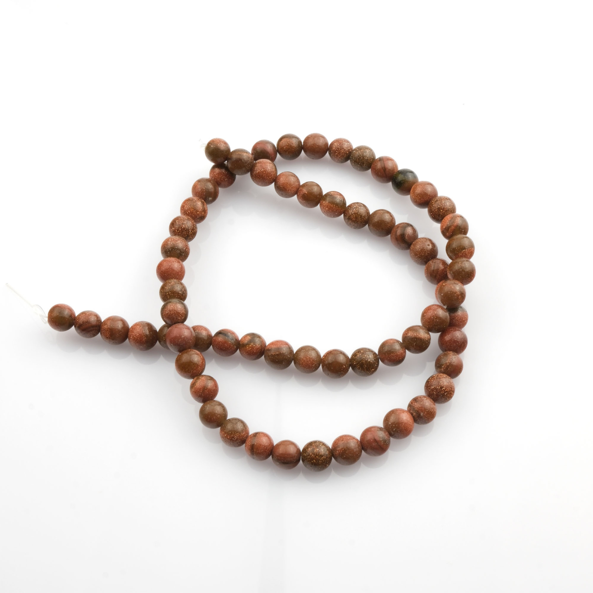 Kahverengi Yıldız Taşı doğal taş dizi 6mm – sıcak kahverengi tonları ve yıldızlı ışıltısıyla özgüven, denge ve huzur enerjisi sunan toptan doğal taş dizi