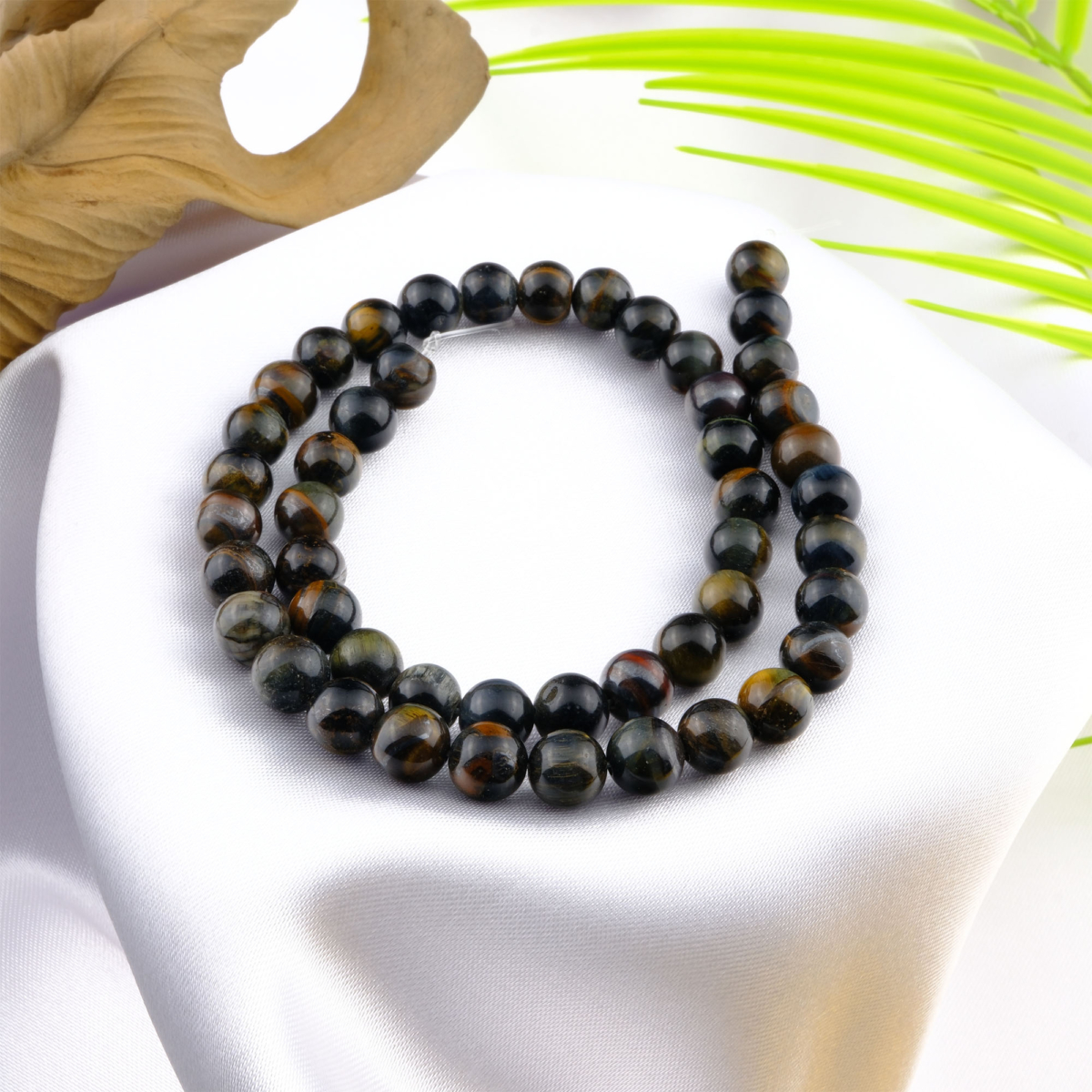 Kaplangözü toptan doğal taş dizi 8mm – altın ve kahverengi tonlarıyla cesaret, denge ve koruma enerjisi yayan güçlü doğal taş modeli.