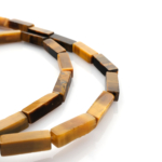 Kaplangözü doğal taş dizi — toptan doğal taş dizi; altın kahverengi çizgileriyle koruma, cesaret ve odaklanma enerjisi sağlayan taş.