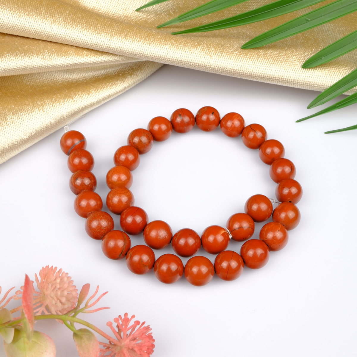 Kırmızı Jasper toptan doğal taş dizi 12mm – kırmızı tonlarıyla güç, kararlılık ve topraklanma enerjisi sağlayan doğal taş modeli.