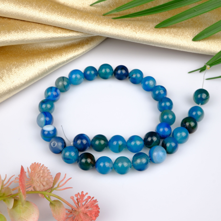 Madagaskar Akik doğal taş dizi 12mm – toprak tonlarıyla denge sağlayan, enerjiyi uyumlaştıran ve takı tasarımlarında zarif görünüm sunan toptan doğal taş dizi