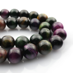 Renkli Kaplangözü doğal taş dizi 10mm – altın, mavi ve kırmızı tonların birleşimiyle güç, cesaret ve koruma enerjisini yansıtan toptan doğal taş dizi