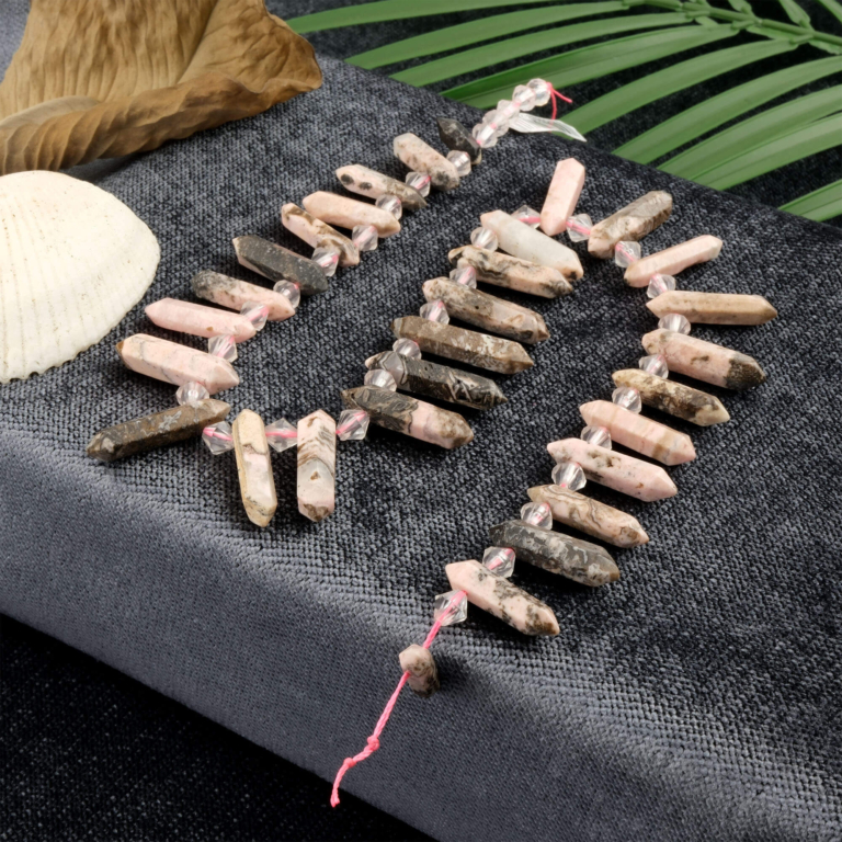 Rodonit toptan doğal taş dizi – pembe ve siyah tonlarıyla kalp çakrasını dengeleyen, sevgi ve şefkat enerjisi yayan doğal taş.