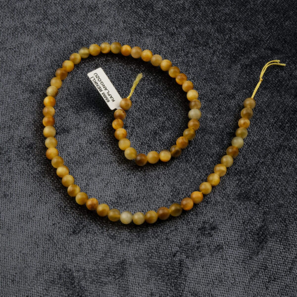 Sarı Kaplan Gözü doğal taş dizi 6mm – altın sarısı ışıltısıyla koruma, özgüven ve odaklanma enerjisi sağlayan toptan doğal taş dizi.