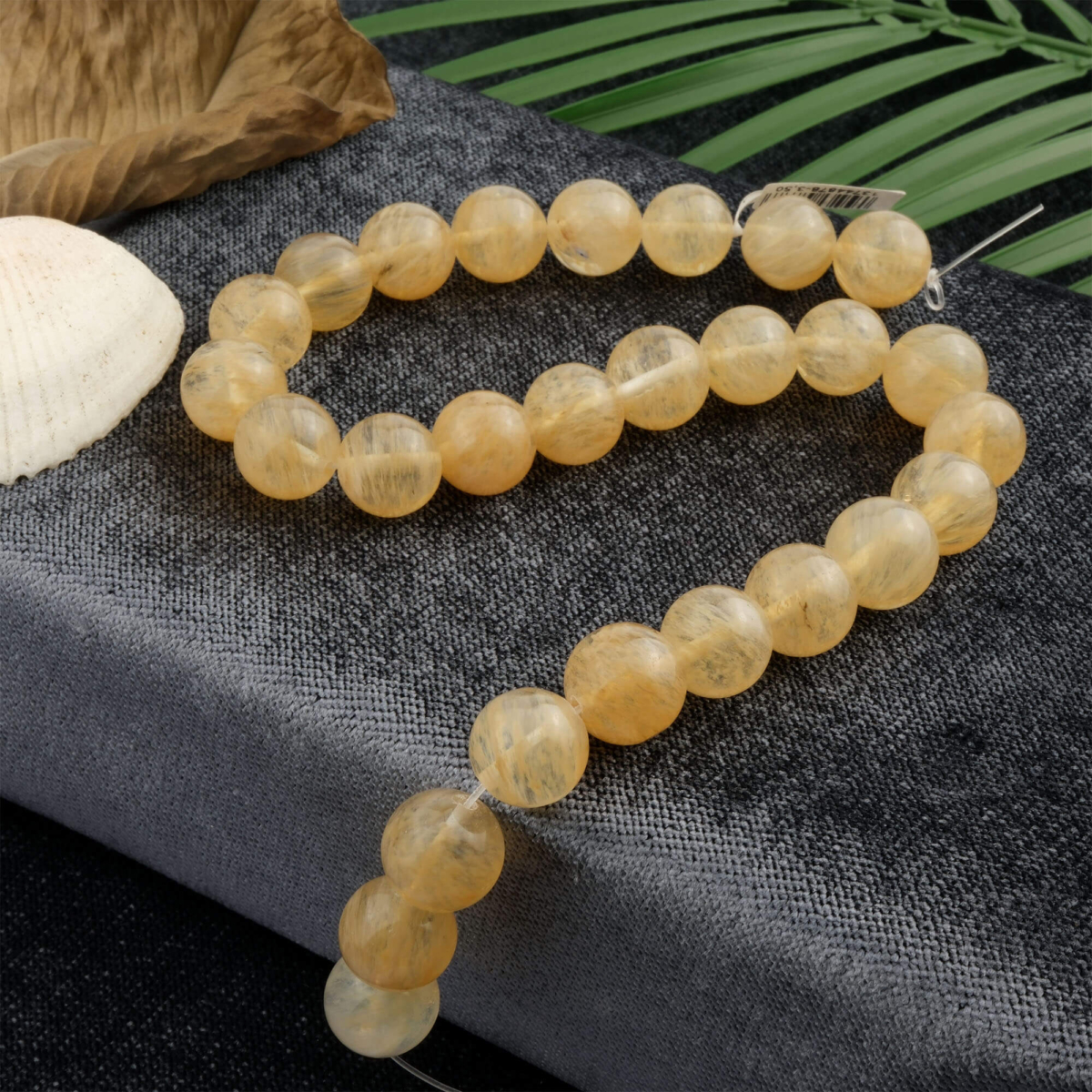 Sarı Rutilli Kuvars toptan doğal taş dizi 14mm – altın ipeksi rutil damarlarıyla enerji, canlılık ve bolluk frekansını yükselten güçlü doğal taş modeli.