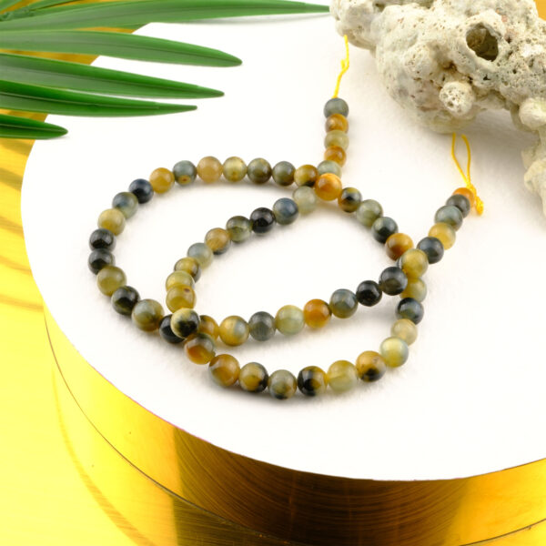 Sarı Siyah Kaplan Gözü doğal taş dizi 6mm – kontrast renkleriyle koruma, güç ve odaklanma enerjisini birleştiren toptan doğal taş dizi.