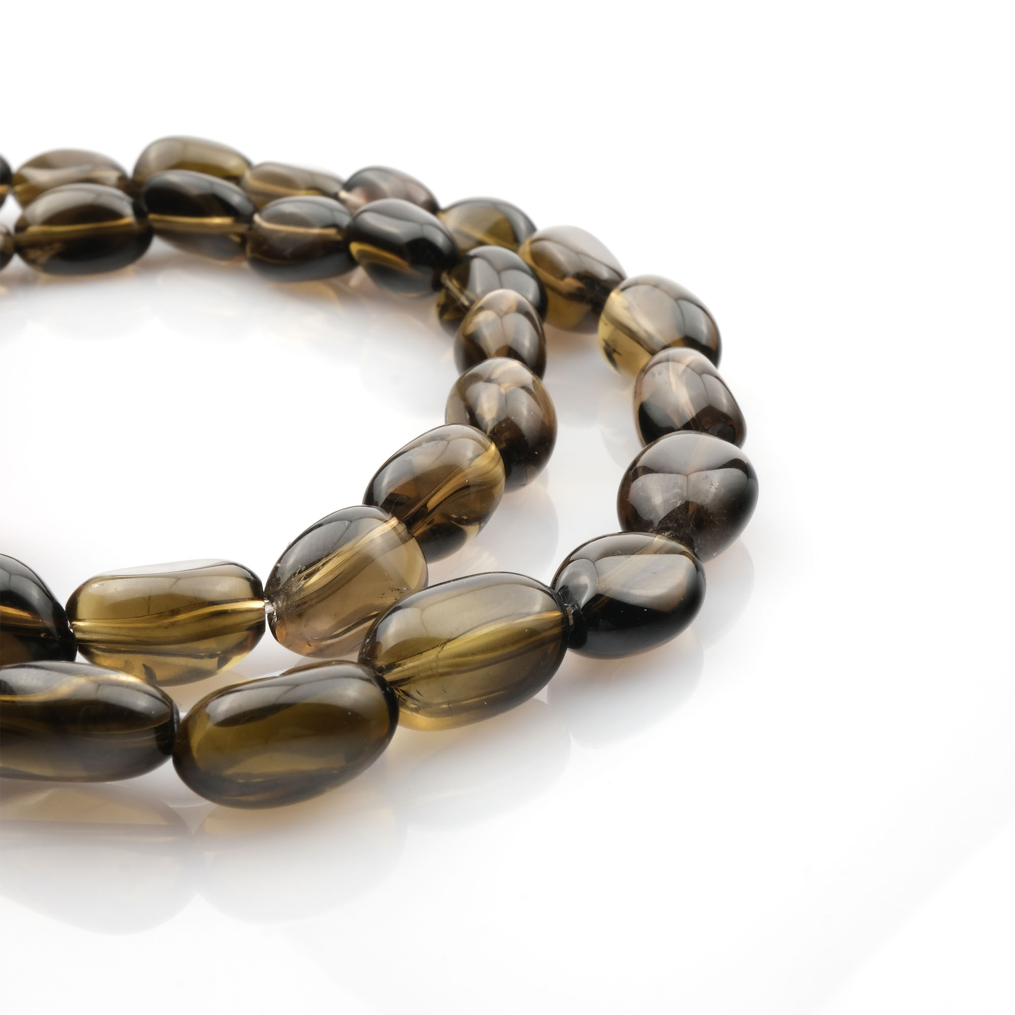 Tamburlu kesim Dumanlı Kuvars taşı, toprak tonlarında yumuşak yüzeyli formuyla koruma, denge ve arınma enerjisini sunan toptan doğal taş dizi.