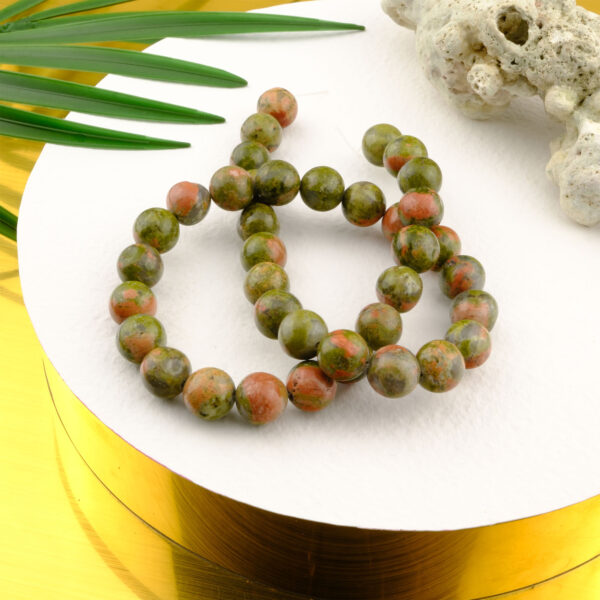 Unakit doğal taş dizi 10mm – yeşil ve pembe tonların eşsiz uyumuyla şifa, denge ve iç huzur enerjisi sunan toptan doğal taş dizi.