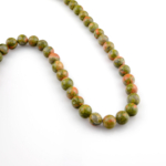 Unakit doğal taş dizi 10mm – yeşil ve pembe tonların eşsiz uyumuyla şifa, denge ve iç huzur enerjisi sunan toptan doğal taş dizi.