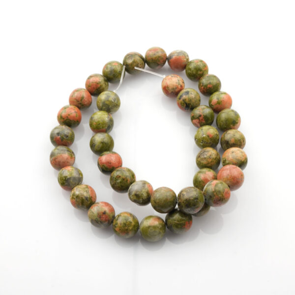 Unakit doğal taş dizi 10mm – yeşil ve pembe tonların eşsiz uyumuyla şifa, denge ve iç huzur enerjisi sunan toptan doğal taş dizi.