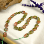 Unakit doğal taş dizi — toptan doğal taş dizi; pembe ve yeşil tonlarıyla denge ve uyum enerjisi sağlayan zarif takı tasarımları için idealdir.