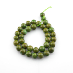Yeşil Jasper 10mm toptan doğal taş dizi – doğanın huzurunu yansıtan yeşil tonlarıyla enerji çalışmaları, bileklik ve kolye tasarımları için mükemmel seçim.
