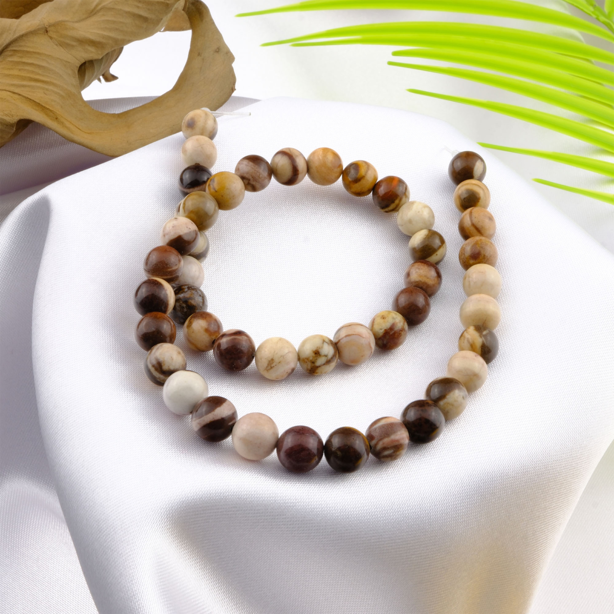 Zebra Jasper doğal taş dizi 8mm – siyah ve beyaz çizgili yapısıyla denge, güç ve odaklanma enerjisi sağlayan toptan doğal taş dizi.