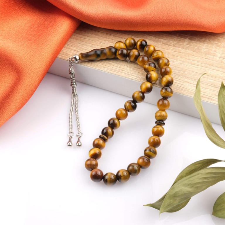 Toptan doğal taş 2A kalite kaplangözü tesbih, altın kahverengi ışık yansımalarıyla güç ve cesaret enerjisi sunan, manevi kullanım için özel doğal taş tesbih