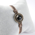 Obsidyen taşı bakır bileklik – güçlü koruma enerjisi ve şık bakır uyumu