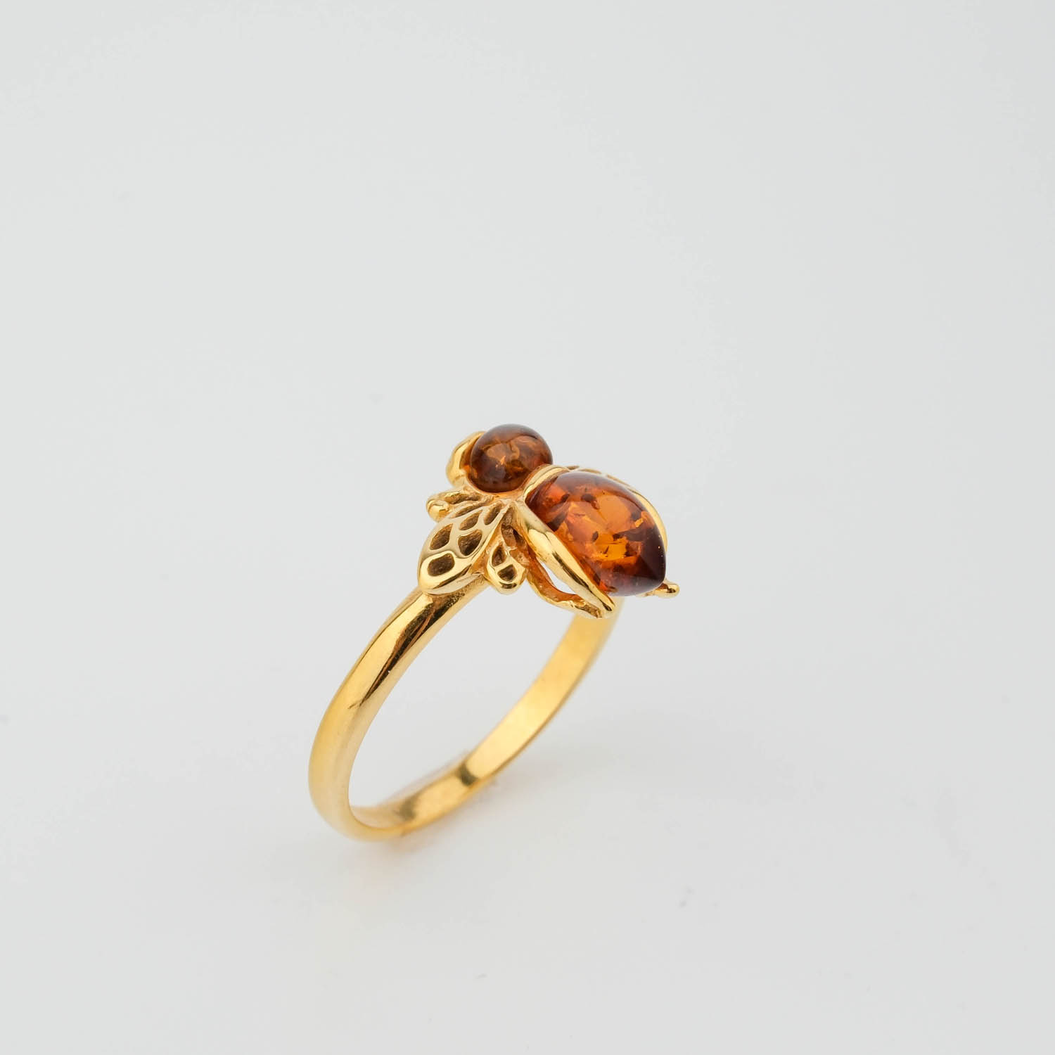 Bague pour femme en argent 925 plaqué or avec pierre d'ambre originale et motif abeille.
