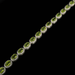 925 sterling silver women's bracelet designed with oval cut original peridot natural stones and sparkling details.
