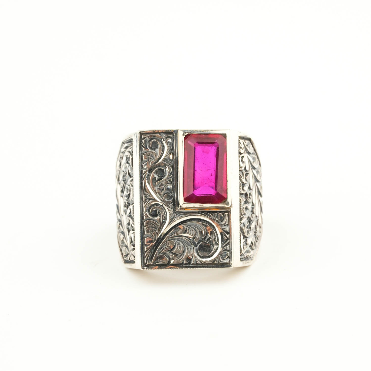 925 sterling silver men's ring featuring a rectangular facet cut original ruby natural stone in a rectangular frame with handcrafted floral motifs.