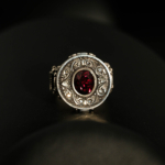 925 sterling silver men's ring featuring a round original garnet natural stone and detailed handcrafted motifs.