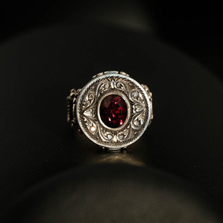 925 sterling silver men's ring featuring a round original garnet natural stone and detailed handcrafted motifs.