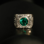 925 sterling silver men's ring featuring a facet cut original paraiba color topaz natural stone in a square frame with handcrafted floral motifs.