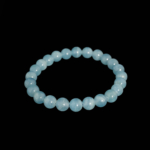 A luxury flexible natural stone bracelet made of 8-9mm round smooth translucent light blue calcite beads.