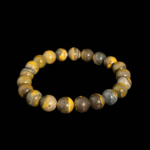 A luxury flexible natural stone bracelet made of 9-10mm round smooth bumblebee jasper beads with yellow and black bands.