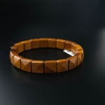 Square rolex cut original tiger's eye natural stone bracelet in golden brown tones.