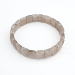 Bracelet flexible de conception élégante coupe rolex fait de pierre naturelle de quartz fumé translucide originale.