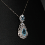 An elegant 925 sterling silver design necklace featuring faceted blue topaz stones enclosed in cubic zirconia frames, shown in DSCF0704.jpg.