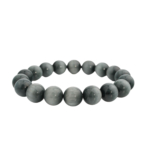 A flexible natural stone bracelet made of round smooth grey cat's eye beads with chatoyant effect.