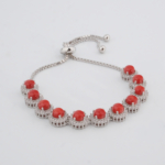 Bracelet coulissant en argent sterling 925 doté de 9 coraux rouges entourés de montures rondes en zircone, présenté dans DSCF0676.jpg.